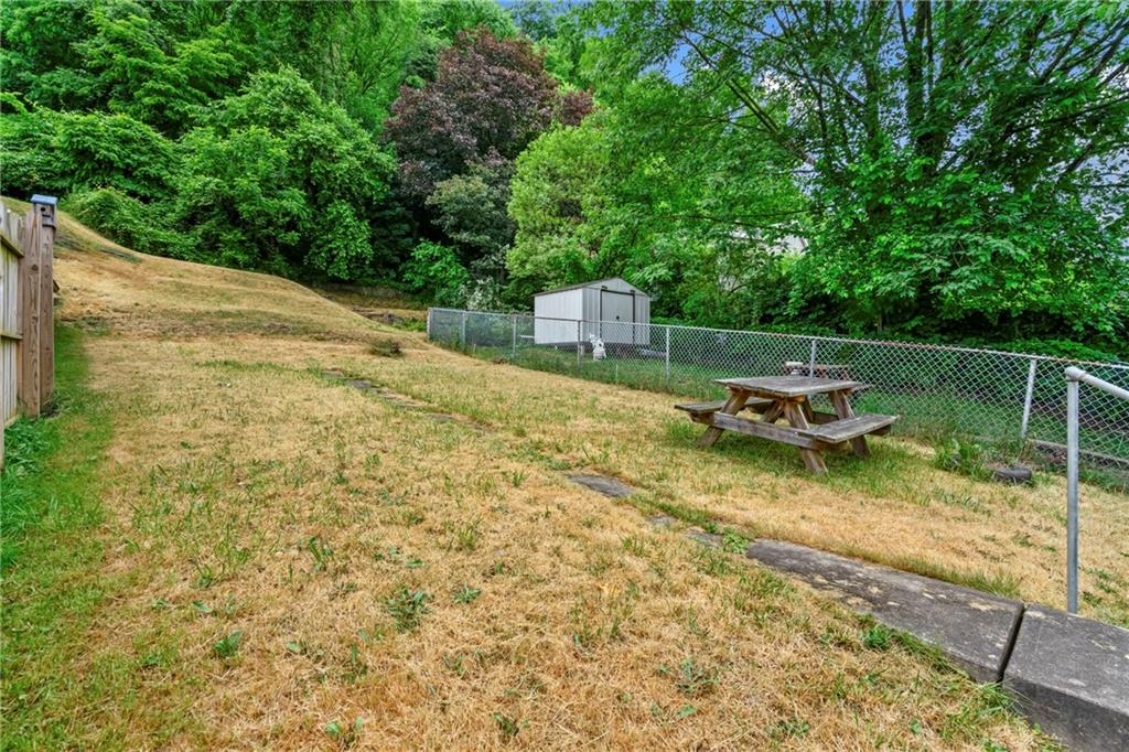 723 Freeport Road Creighton, PA 15030 - Photo 26 of 27 a backyard of a house with chairs