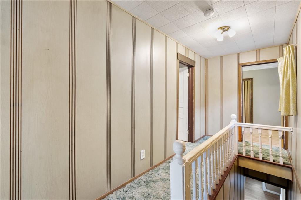 723 Freeport Road Creighton, PA 15030 - Photo 8 of 27 a view of a hallway with wooden floor and staircase
