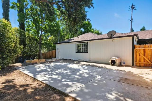 a view of a outdoor space and a front view of a house