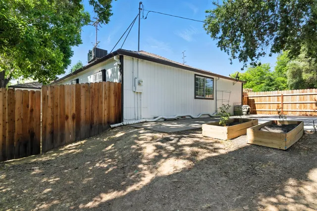 a view of a backyard with furniture
