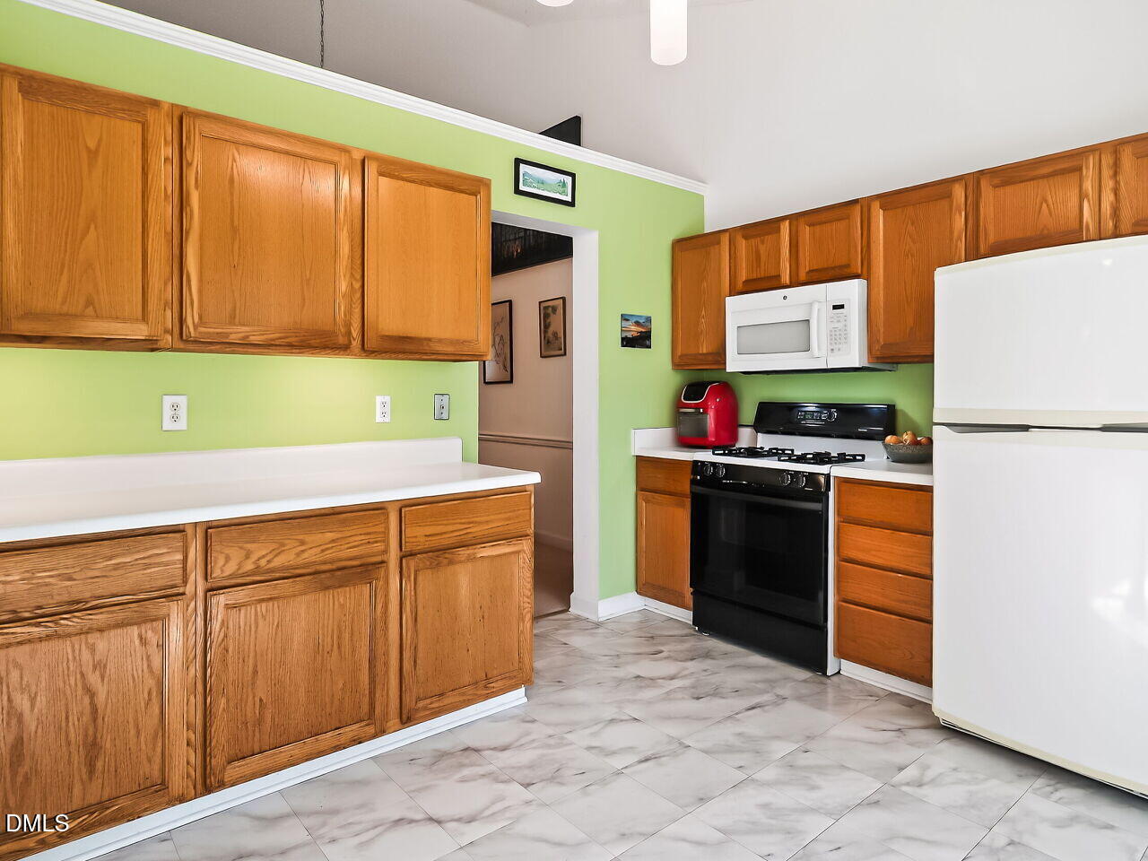 5 Flagstaff Court Durham, NC 27713 - Photo 11 of 40 a kitchen with stainless steel appliances a stove and a refrigerator