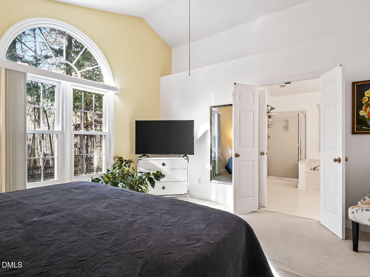 5 Flagstaff Court Durham, NC 27713 - Photo 16 of 40 a bedroom with a bed and a flat screen tv