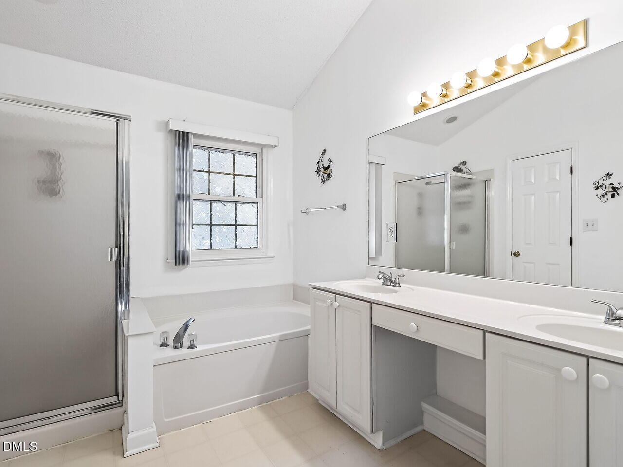 5 Flagstaff Court Durham, NC 27713 - Photo 17 of 40 a bathroom with a tub sink and mirror