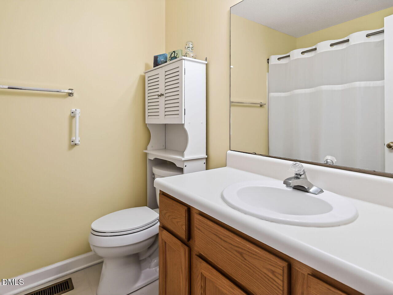5 Flagstaff Court Durham, NC 27713 - Photo 19 of 40 a bathroom with a sink toilet and shower