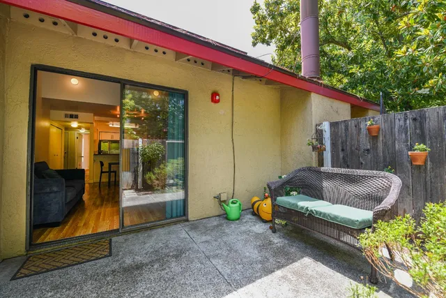 a view of a bench in the backyard