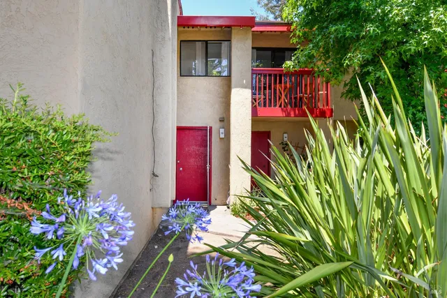 a view of a house with a flower garden