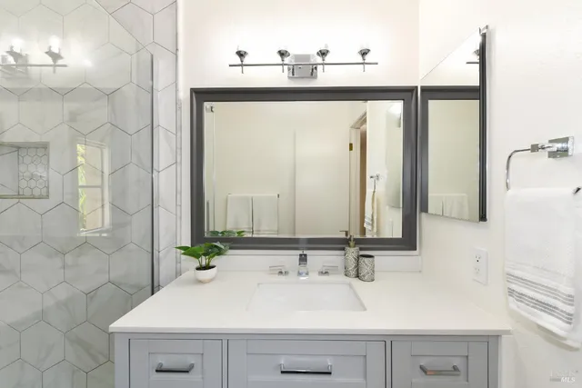 a bathroom with a sink and a mirror