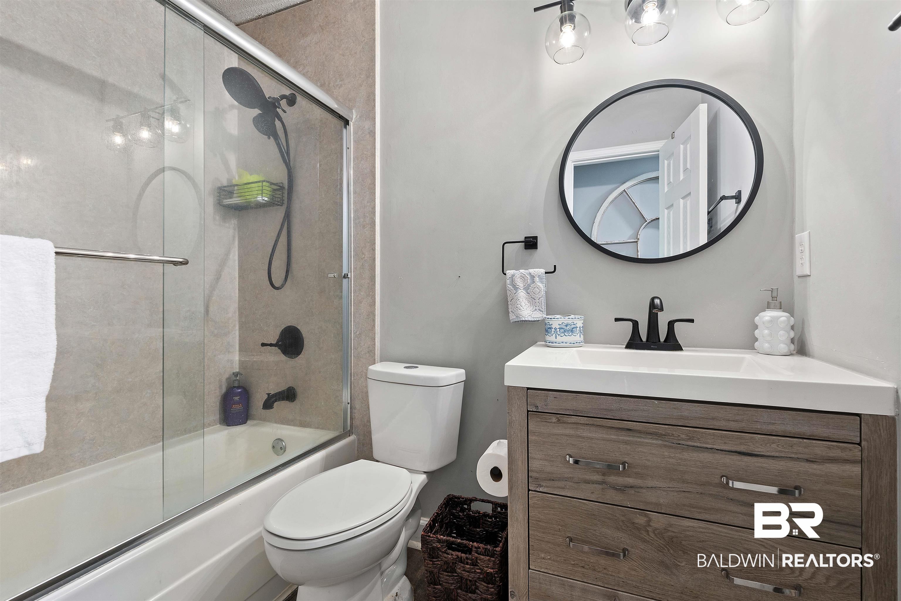 4682 Opal Drive Mobile, AL 36619 - Photo 18 of 27 Full bathroom featuring combined bath / shower with glass door, oversized vanity, and toilet