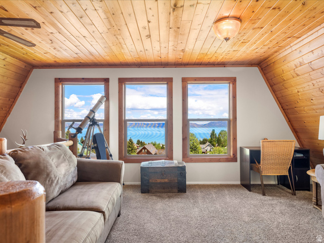 371 Lewis Loop, Unit 29 Fish Haven, ID 83287 - Photo 30 of 40 Wood-paneled ceilings with exposed beams and a flush-mount light fixture