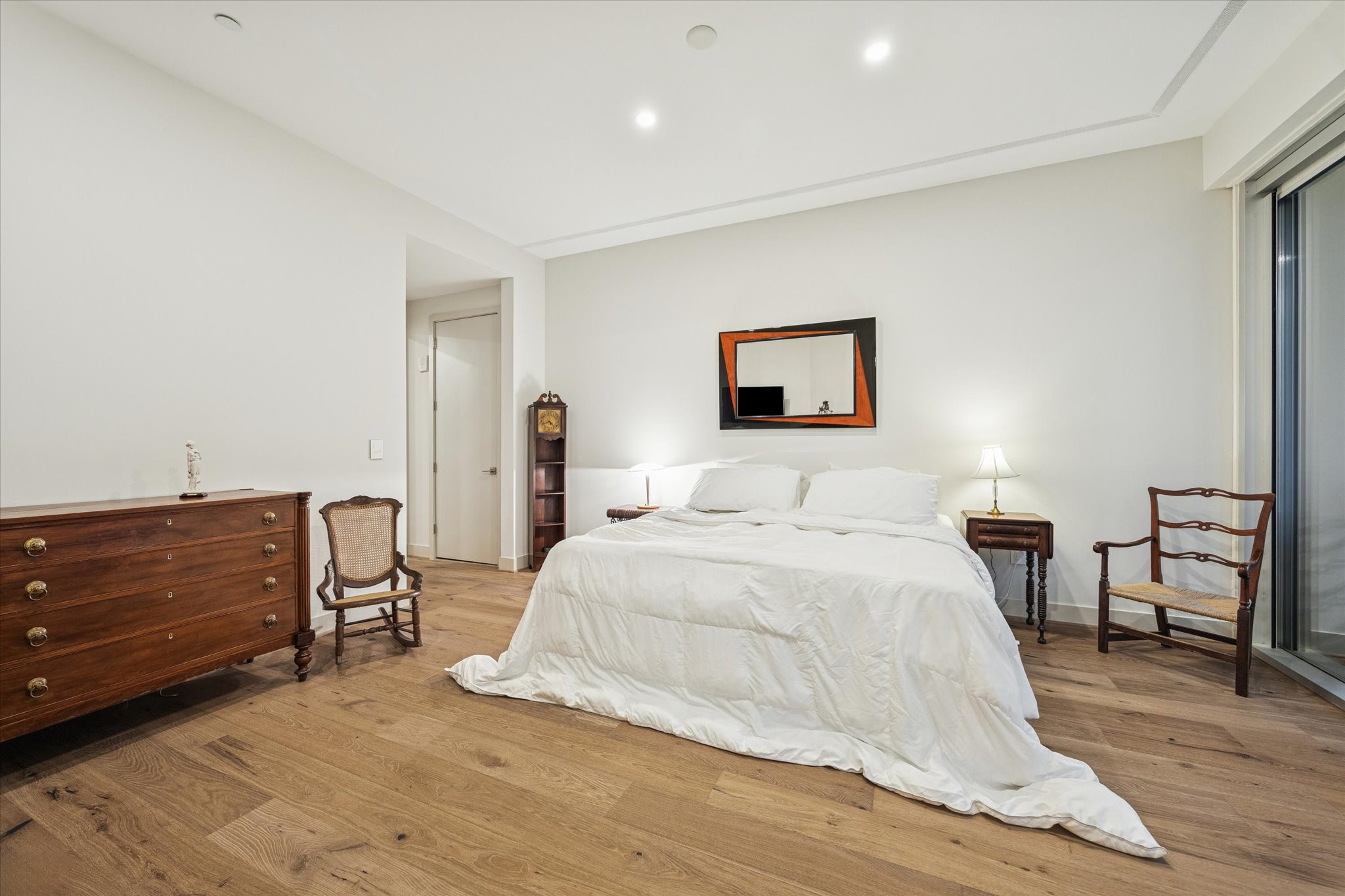 1600 Post Oak Boulevard, Unit 802 Houston, TX 77056 - Photo 8 of 19 a bedroom with a bed and a table