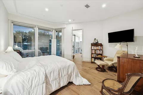 a bedroom with a bed and a table