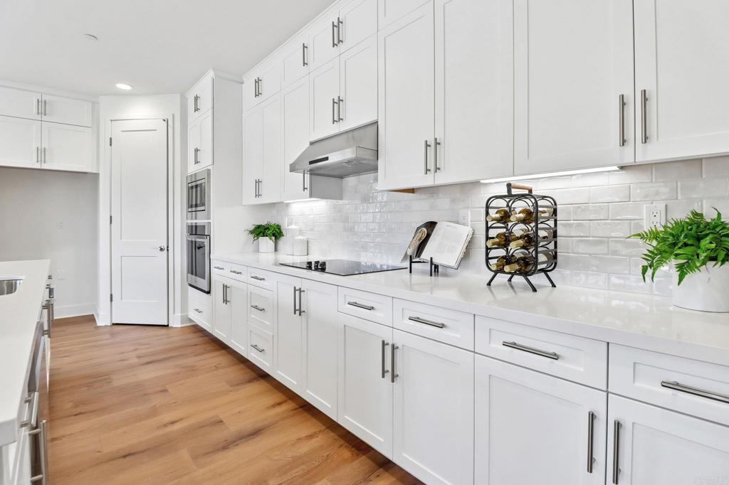 3521 Butler Place Escondido, CA 92027 - Photo 18 of 50 a kitchen with stainless steel appliances white cabinets and a sink