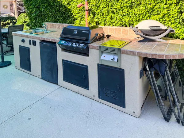 a kitchen with a stove and a refrigerator