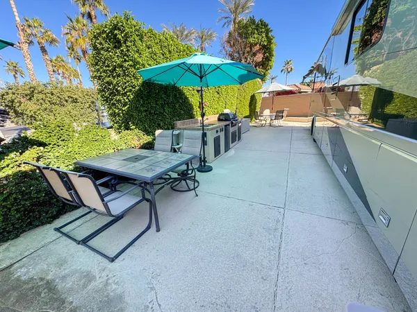 a view of a backyard with sitting area