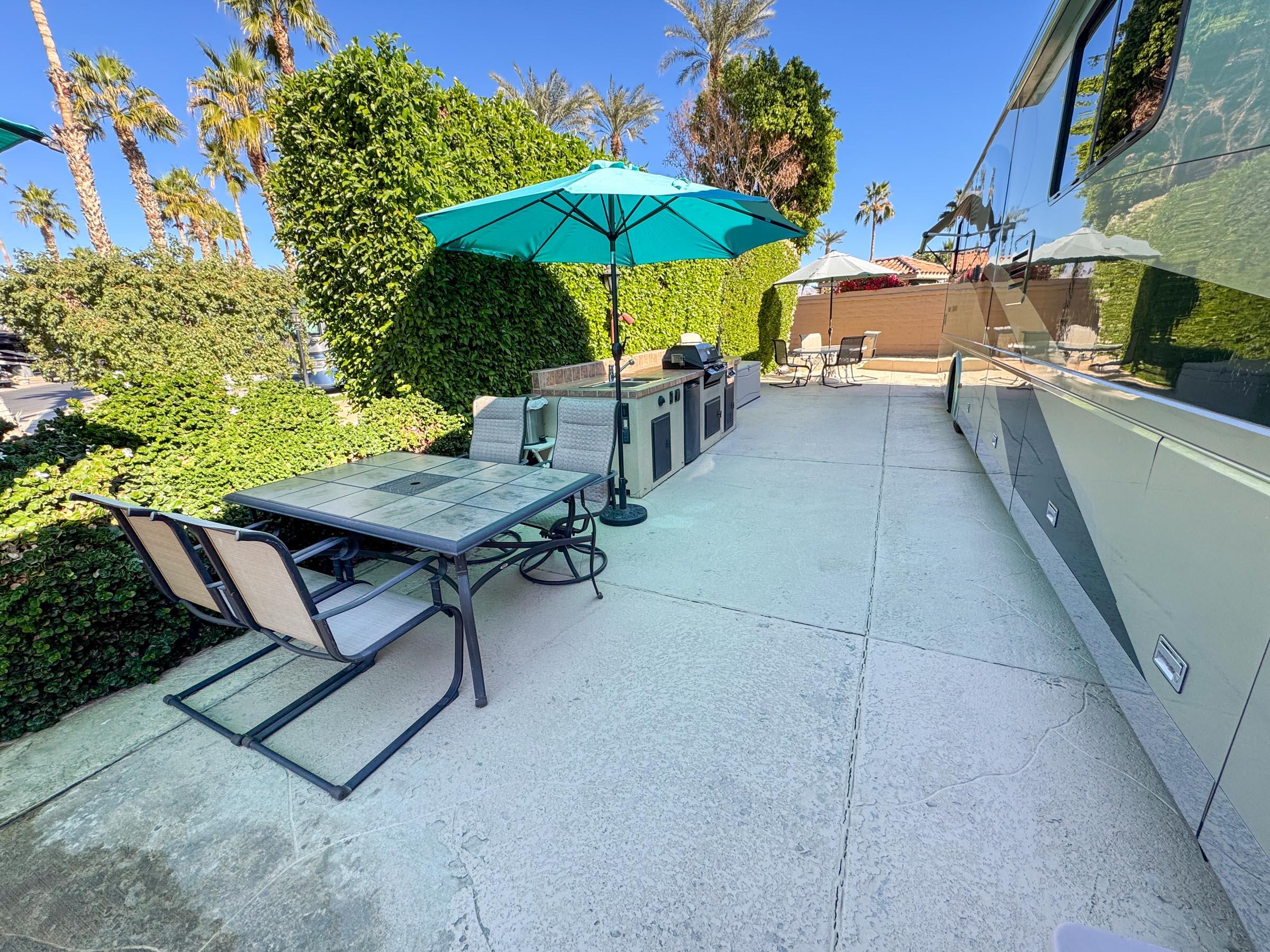 80394 Ave 48, Unit 105 Indio, CA 92201 - Photo 4 of 13 a view of a backyard with sitting area