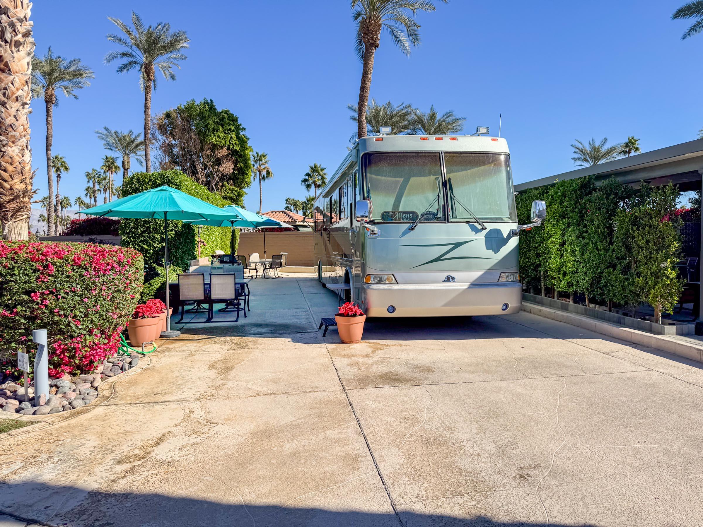 80394 Ave 48, Unit 105 Indio, CA 92201 - Photo 5 of 13 a view of a patio with a table and chairs under an umbrella