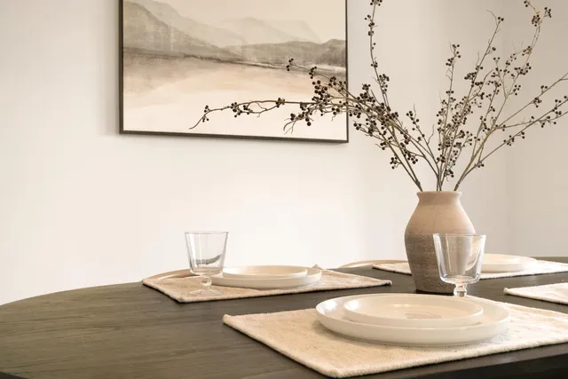 a vase of flowers sitting on a table