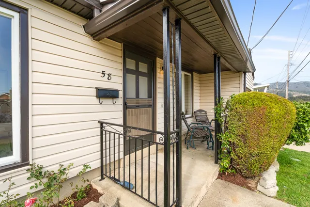 a view of a porch with seating space