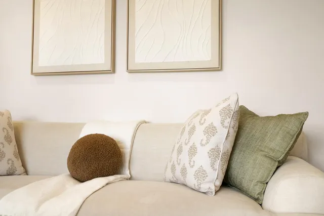 a bedroom with a bed and couch