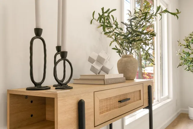a bathroom with a potted plant and a stove