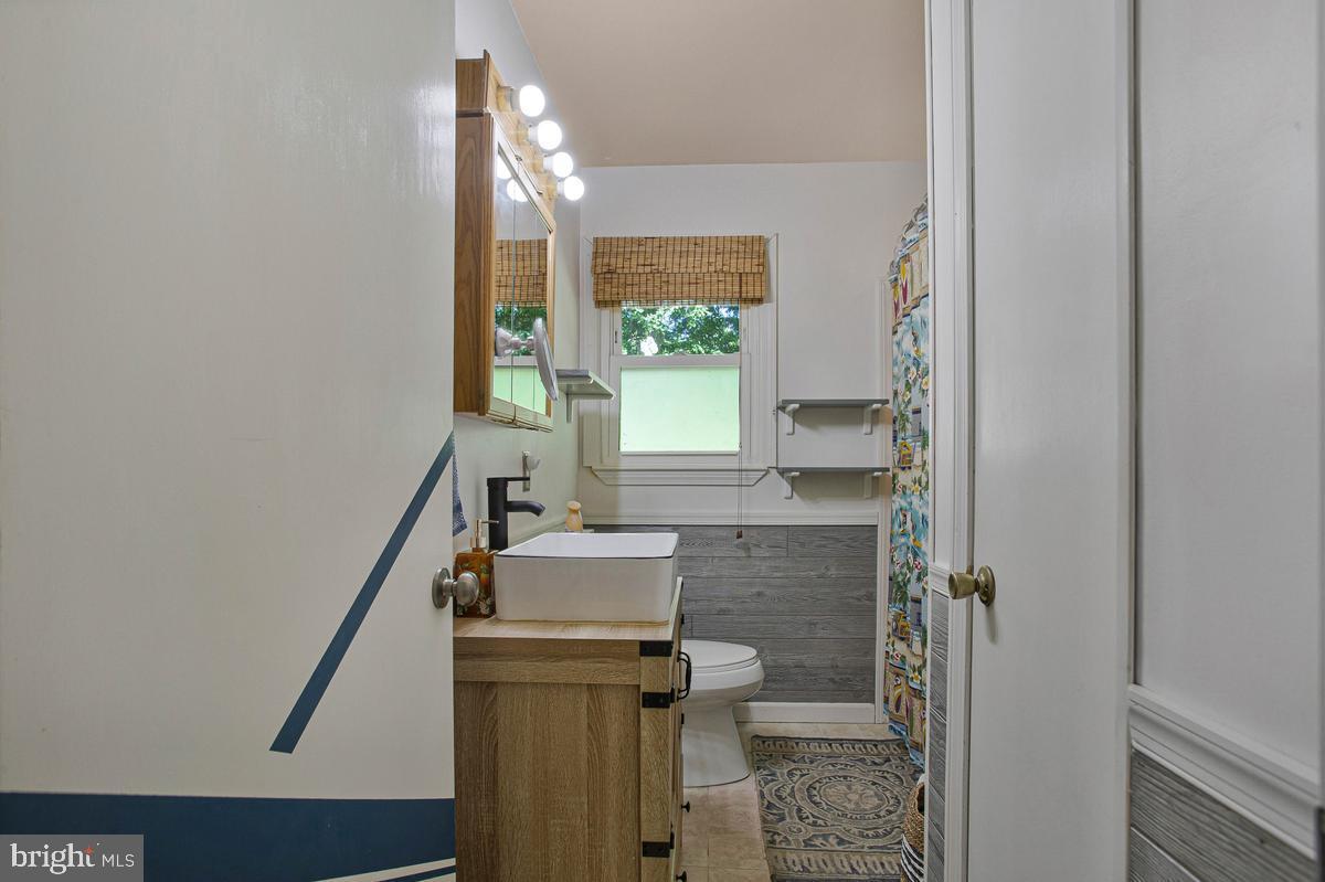 6600 Ashland Road La Plata, MD 20646 - Photo 23 of 40 a bathroom with a sink and a mirror