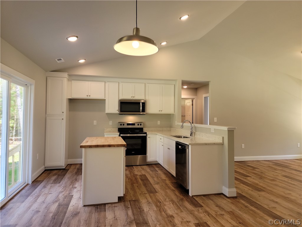 16510 Exter Mill Road Chesterfield, VA 23838 - Photo 11 of 44 a kitchen with stainless steel appliances a white stove top oven a sink dishwasher and a refrigerator with wooden floor