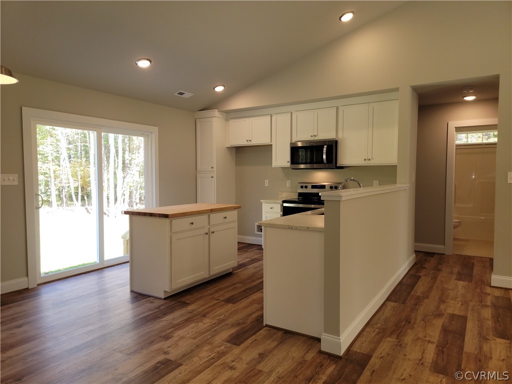 16510 Exter Mill Road Chesterfield, VA 23838 - Photo 13 of 44 a kitchen with a refrigerator a stove top oven and wooden floor