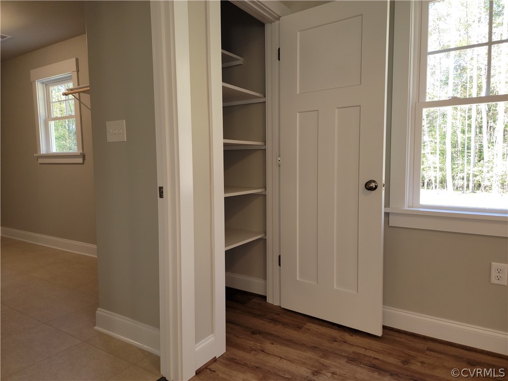 16510 Exter Mill Road Chesterfield, VA 23838 - Photo 18 of 44 a view of an empty room with wooden floor and closet