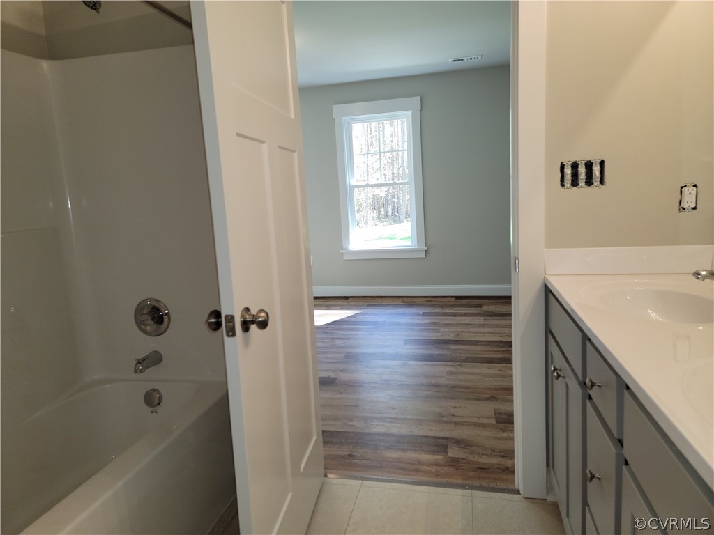 16510 Exter Mill Road Chesterfield, VA 23838 - Photo 24 of 44 a bathroom with a sink a shower and a bathtub