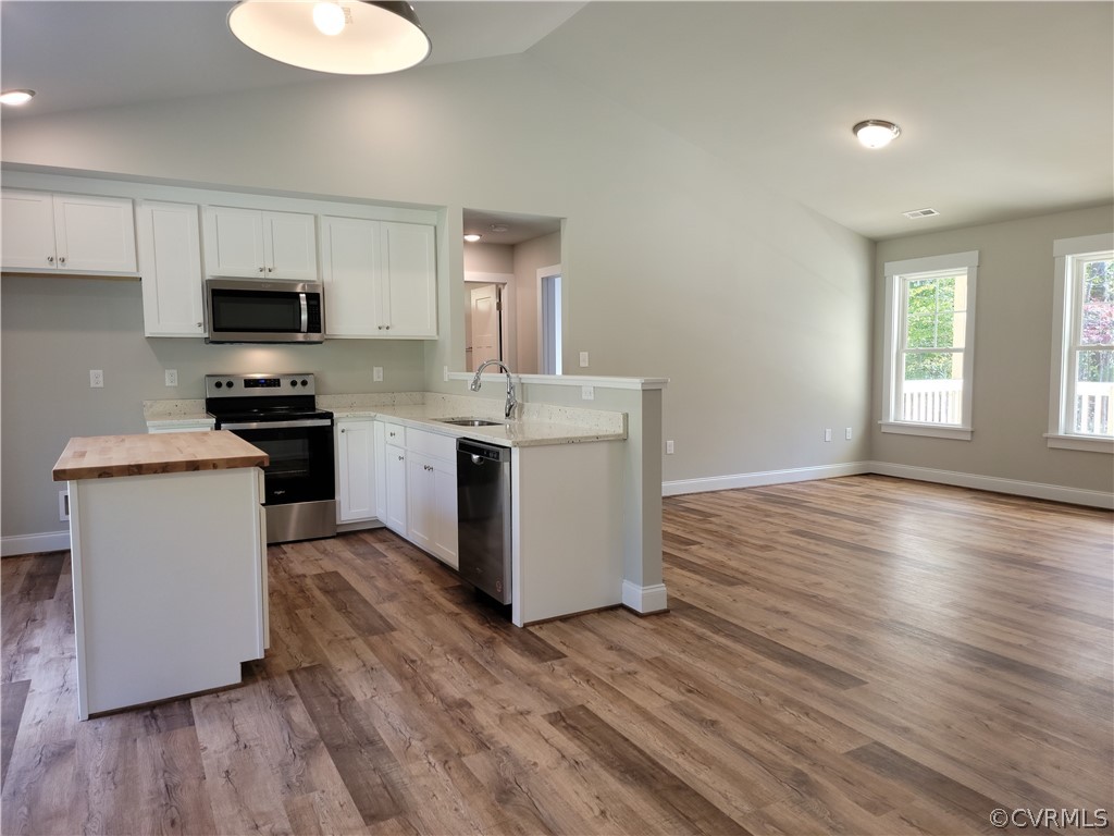 16510 Exter Mill Road Chesterfield, VA 23838 - Photo 8 of 44 a kitchen with stainless steel appliances granite countertop a stove top oven a sink dishwasher and white cabinets with wooden floor