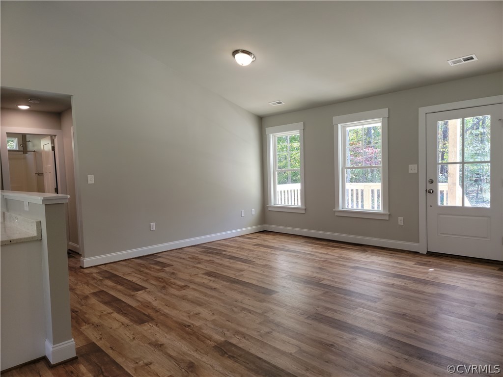 16510 Exter Mill Road Chesterfield, VA 23838 - Photo 9 of 44 an empty room with wooden floor and windows
