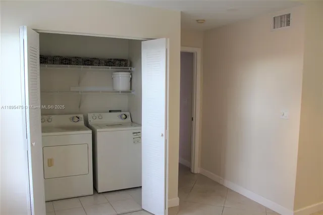 a view of a lake in front of residential houses