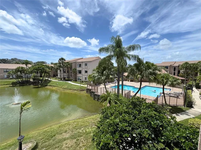 a view of a lake with a building in front of it