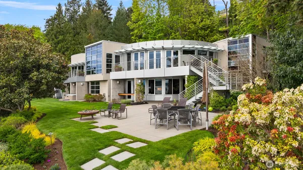 a view of a house with backyard porch and sitting area