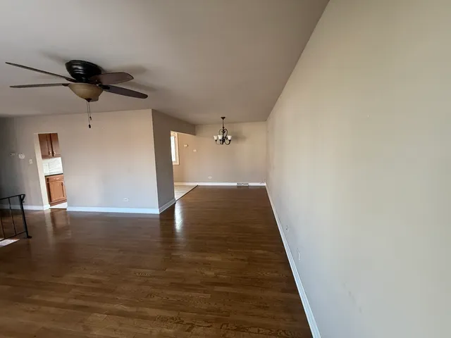 a view of a hallway with a chandelier