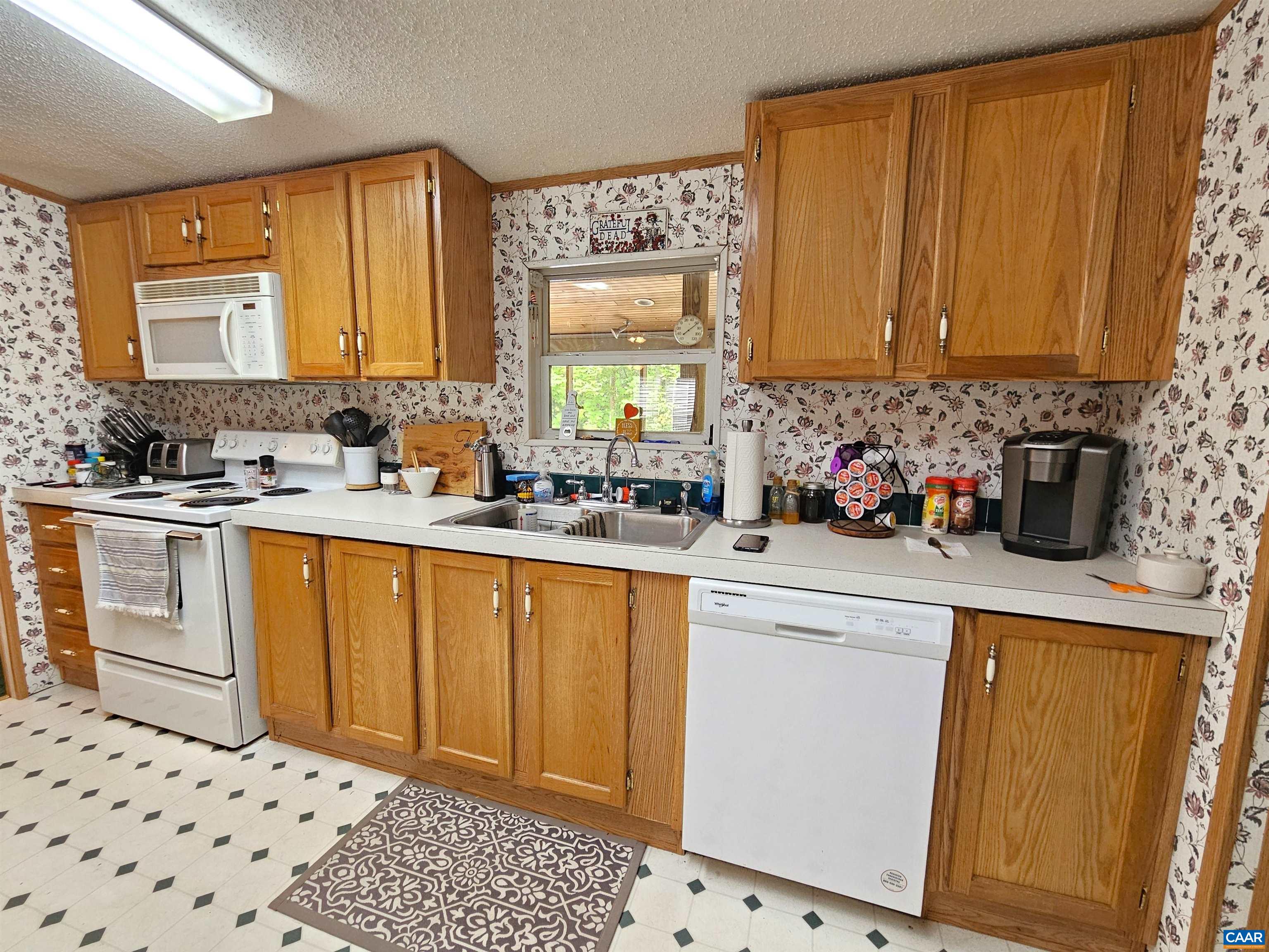 981 Scotts Bottom Road Dillwyn, VA 23936 - Photo 10 of 62 a kitchen with stainless steel appliances a sink a stove a refrigerator and cabinets