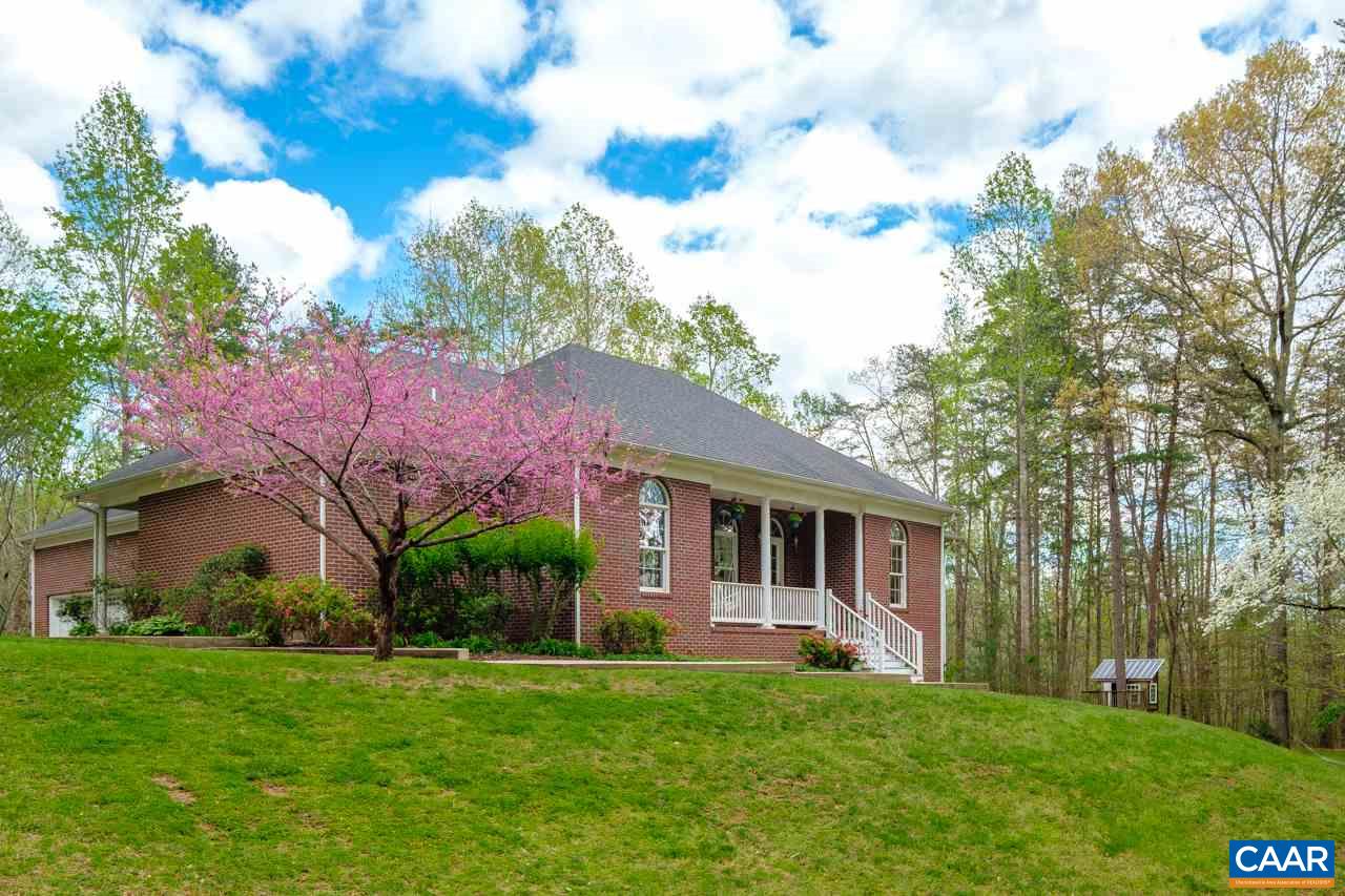 323 Buffalo Run Road Stanardsville, VA 22973 - Photo 1 of 37 a front view of a house with a garden