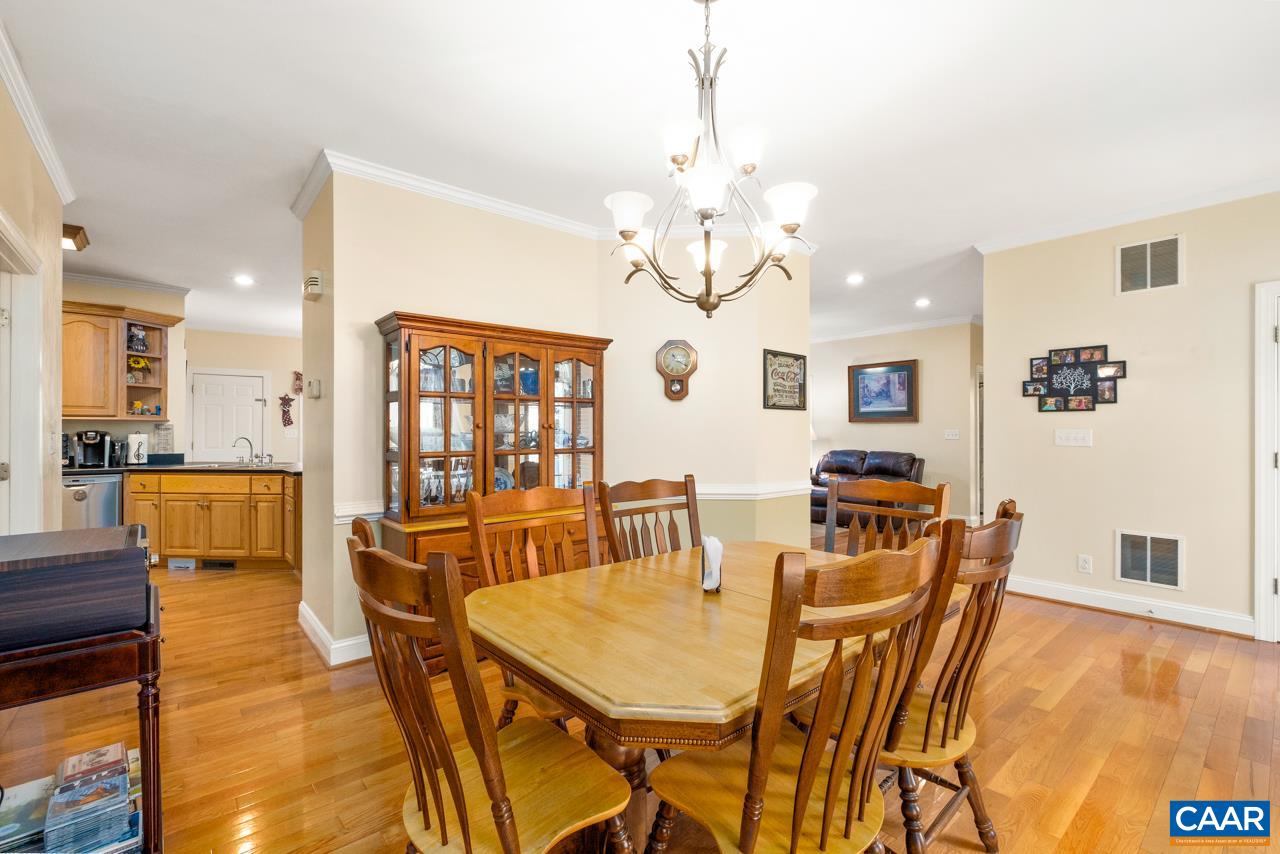 323 Buffalo Run Road Stanardsville, VA 22973 - Photo 11 of 37 a view of a dining room with furniture window and wooden floor