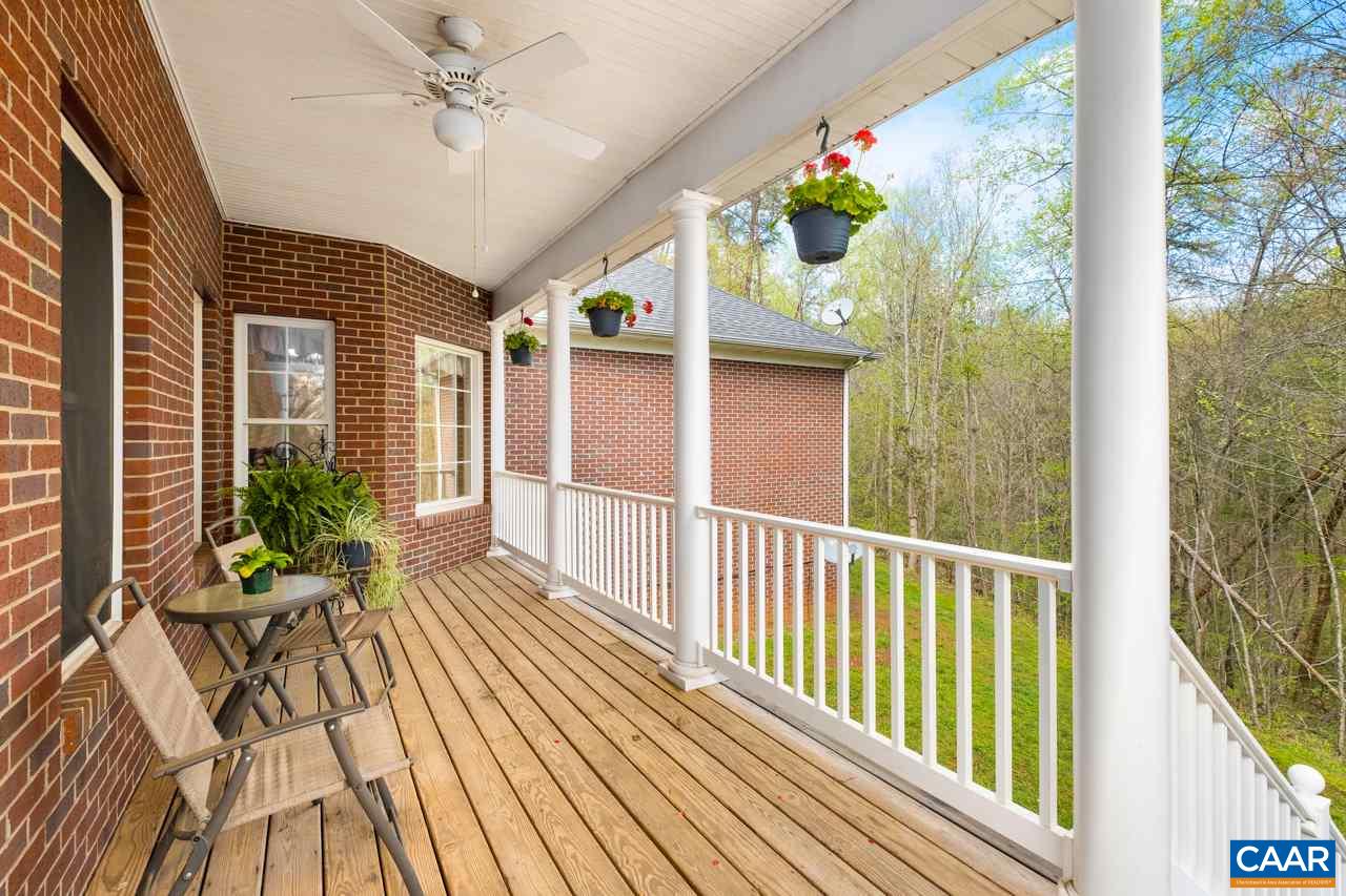 323 Buffalo Run Road Stanardsville, VA 22973 - Photo 20 of 37 a view of a porch with wooden floor