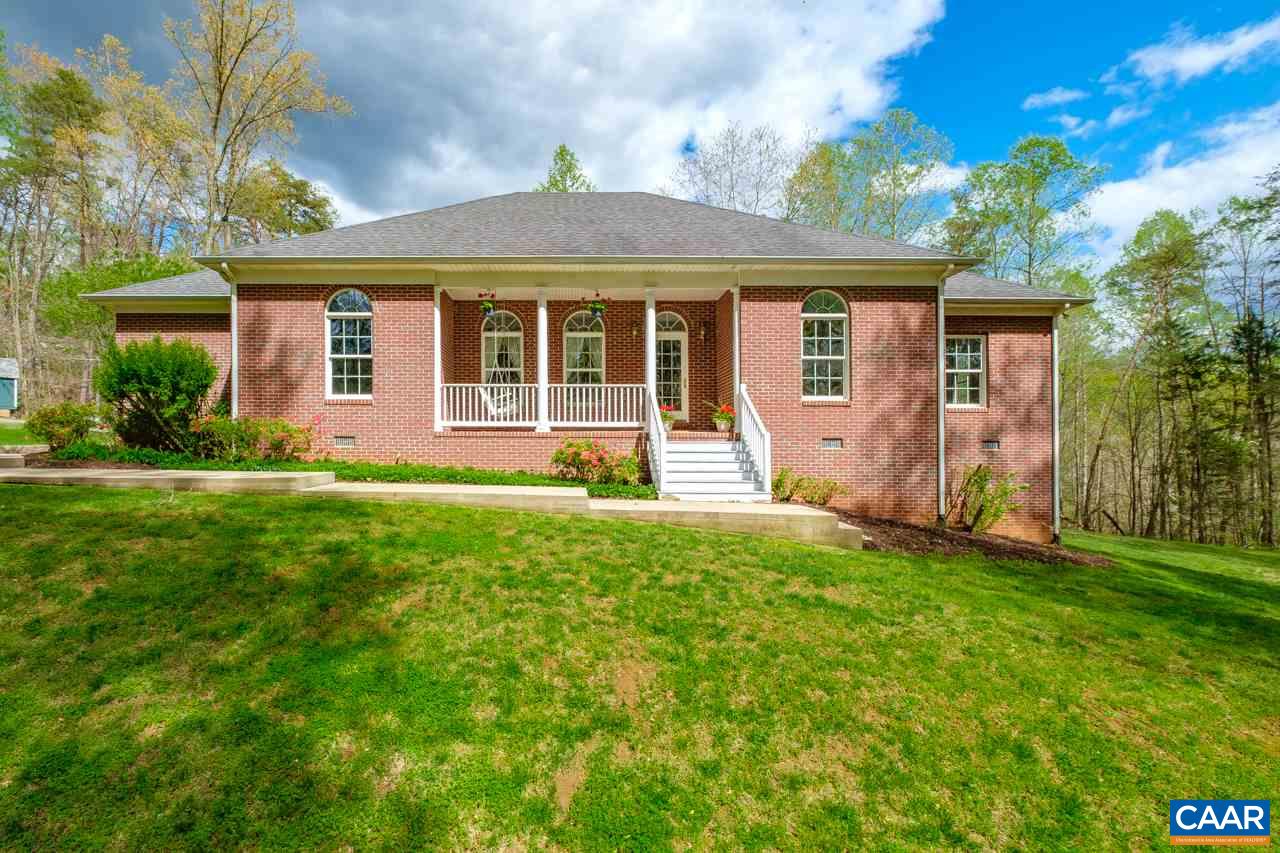 323 Buffalo Run Road Stanardsville, VA 22973 - Photo 2 of 37 a front view of a house with a yard