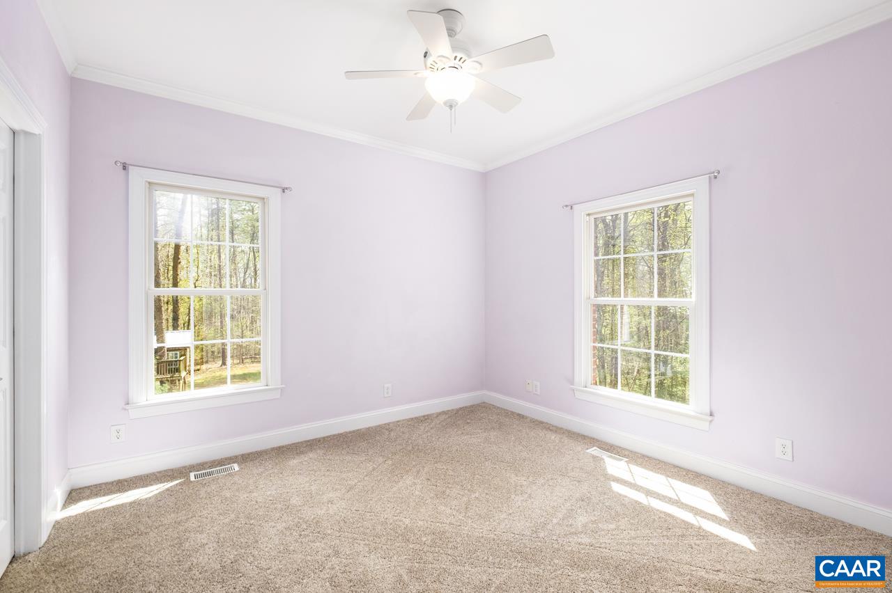 323 Buffalo Run Road Stanardsville, VA 22973 - Photo 24 of 37 an empty room with a window and a ceiling fan