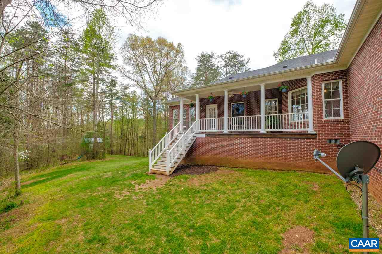 323 Buffalo Run Road Stanardsville, VA 22973 - Photo 32 of 37 a view of a house with backyard and sitting area