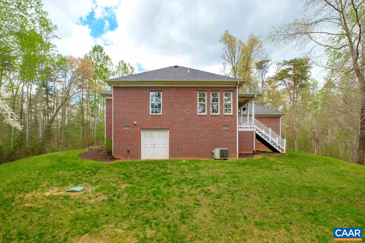 323 Buffalo Run Road Stanardsville, VA 22973 - Photo 36 of 37 a front view of house with yard and trees in the background