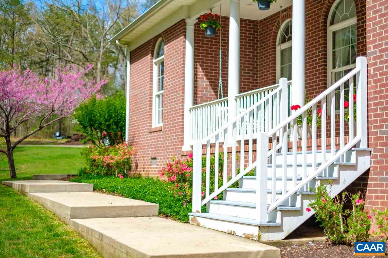 323 Buffalo Run Road Stanardsville, VA 22973 - Photo 7 of 37 a view of a house with a small yard and plants