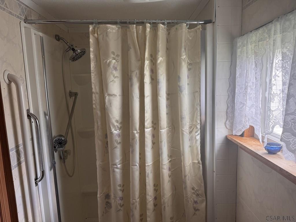 127 1st Street Twin Rocks, PA 15960 - Photo 20 of 20 a bathroom with a shower and a tub