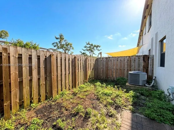 a garden with wooden fence
