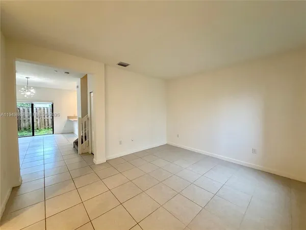 a view of a hallway with wooden shelves