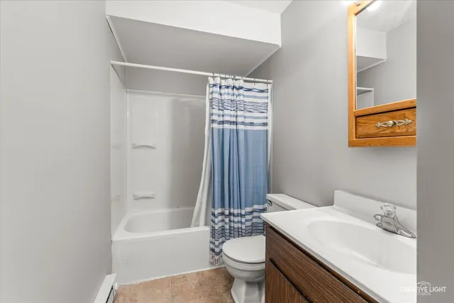 a bathroom with a sink toilet a bathtub and shower