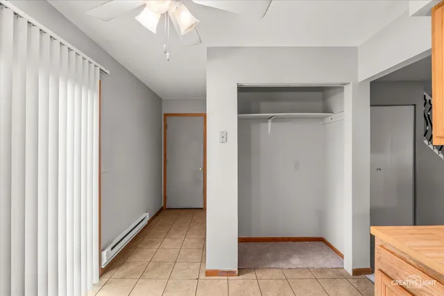 a view of a hallway to rooms