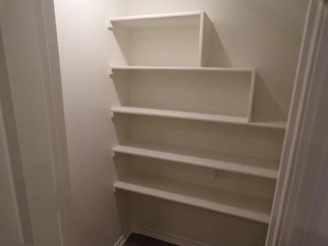 a view of a room with racks on the wall